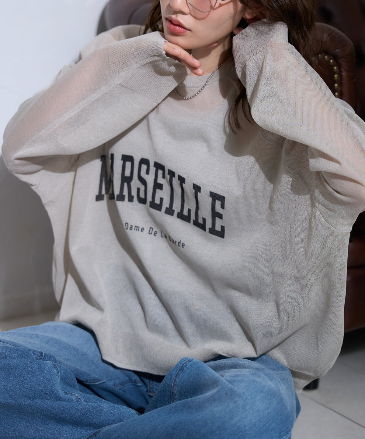 ロゴプリントシアーニット